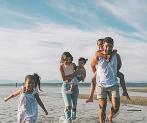 Joyful family after fixing the "family drains you" problem.