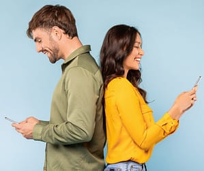 Couple on mobile phones with no affection, showing why marriages quietly die over time.