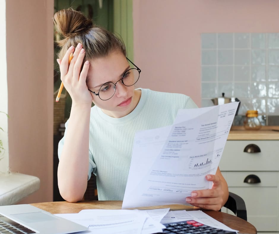 Pen and journal open, words rising: healing from financial debt trauma